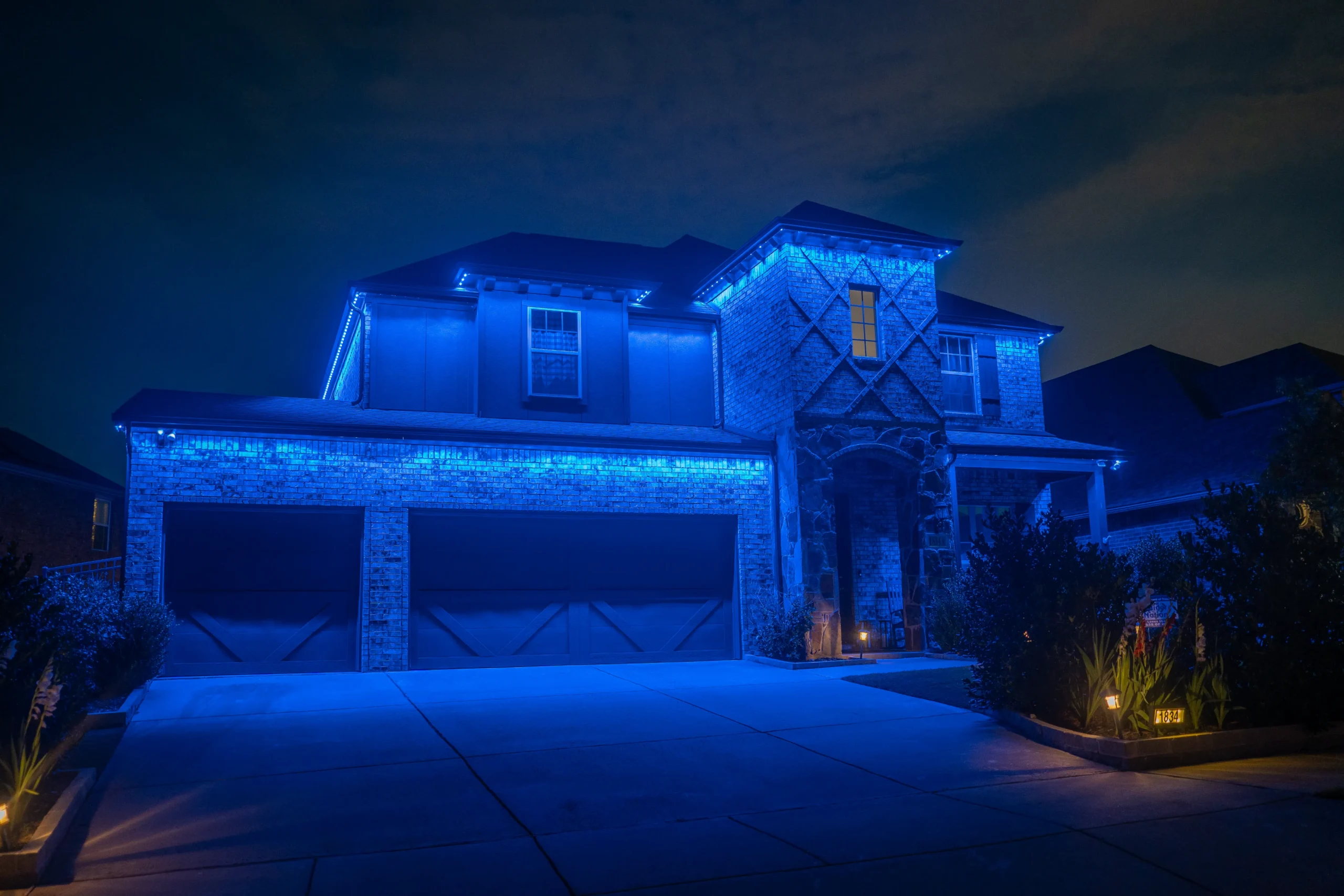 Gameday lighting display on residential home